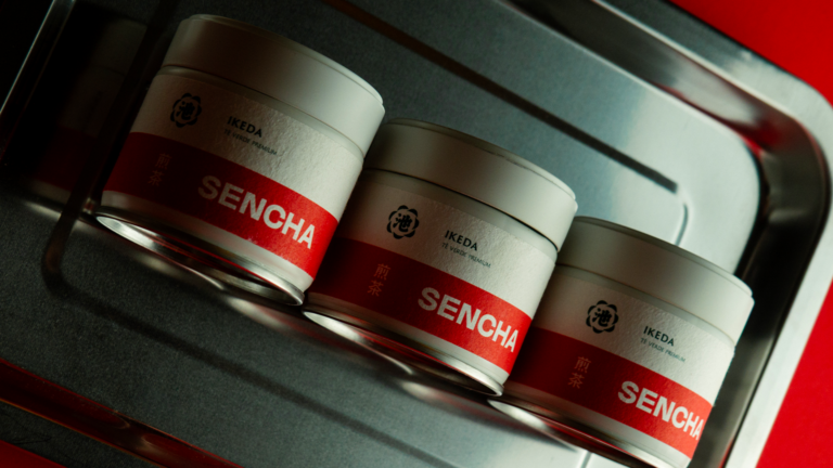 Three Sencha tea tins by Ikeda on a metal tray, photographed as part of the branding, positioning and product photography project for Sencha House.